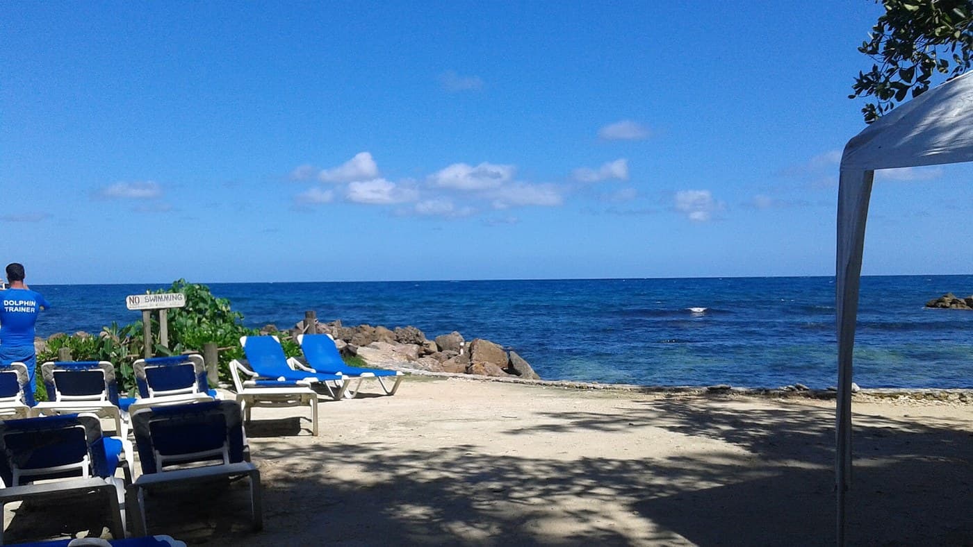 Beach loungers and sea at Runaway Bay, Jamaica
