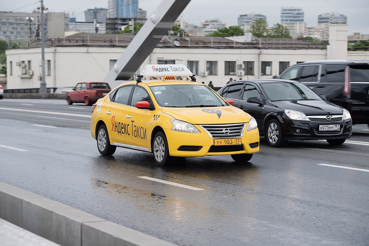 Yellow Yandex taxi on a Moscow street